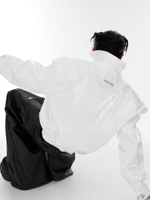 Fashion-forward cropped leather jacket with liquid-like silhouette and statement-making deconstructed shoulders