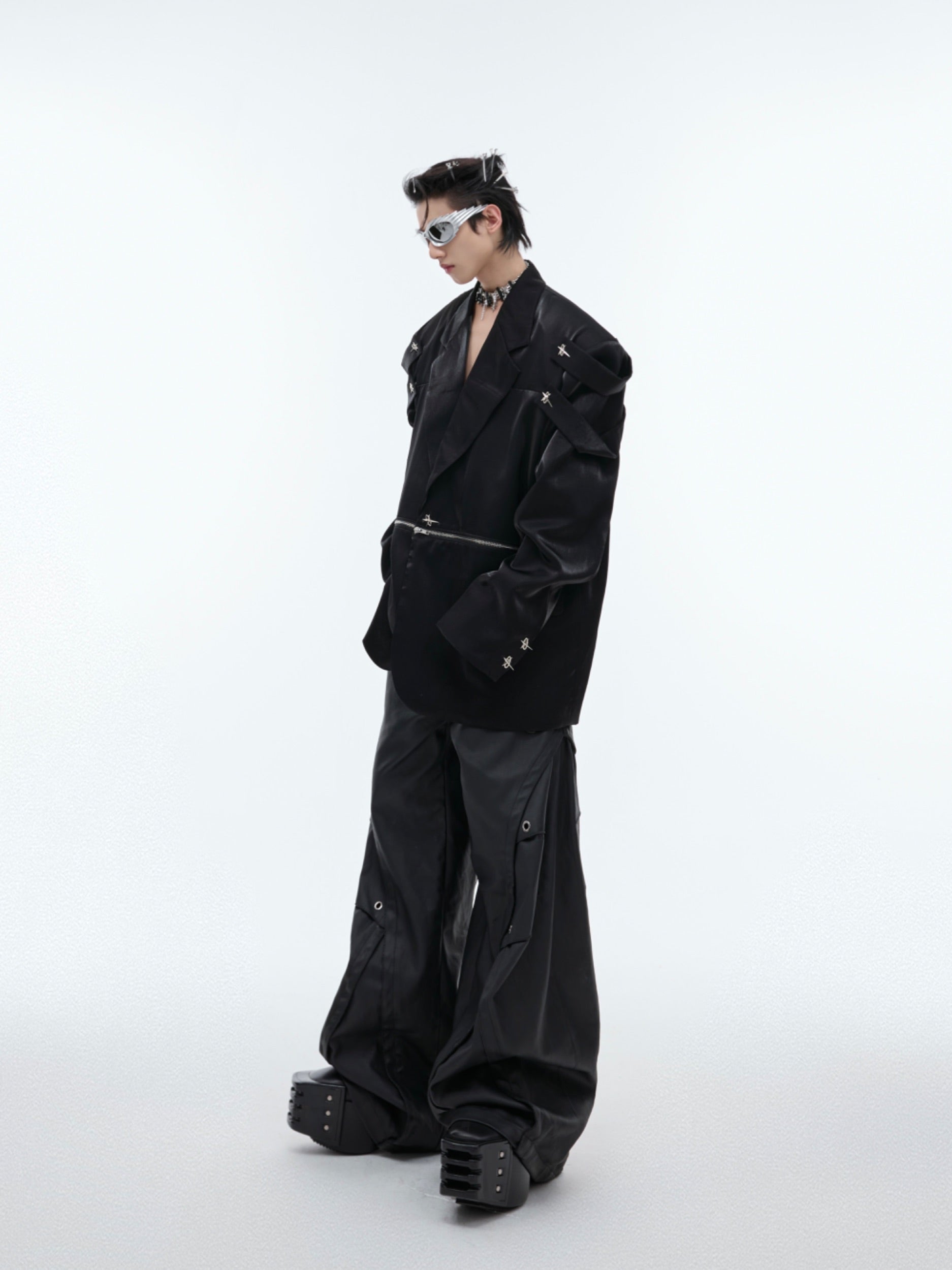 Street-ready oversized blazer worn open to show the deconstructed liquid-level design elements