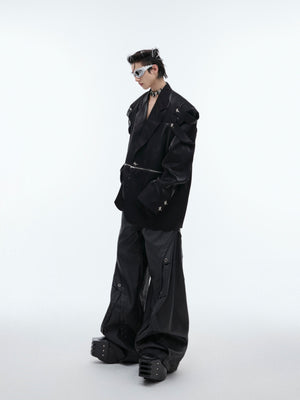 Street-ready oversized blazer worn open to show the deconstructed liquid-level design elements