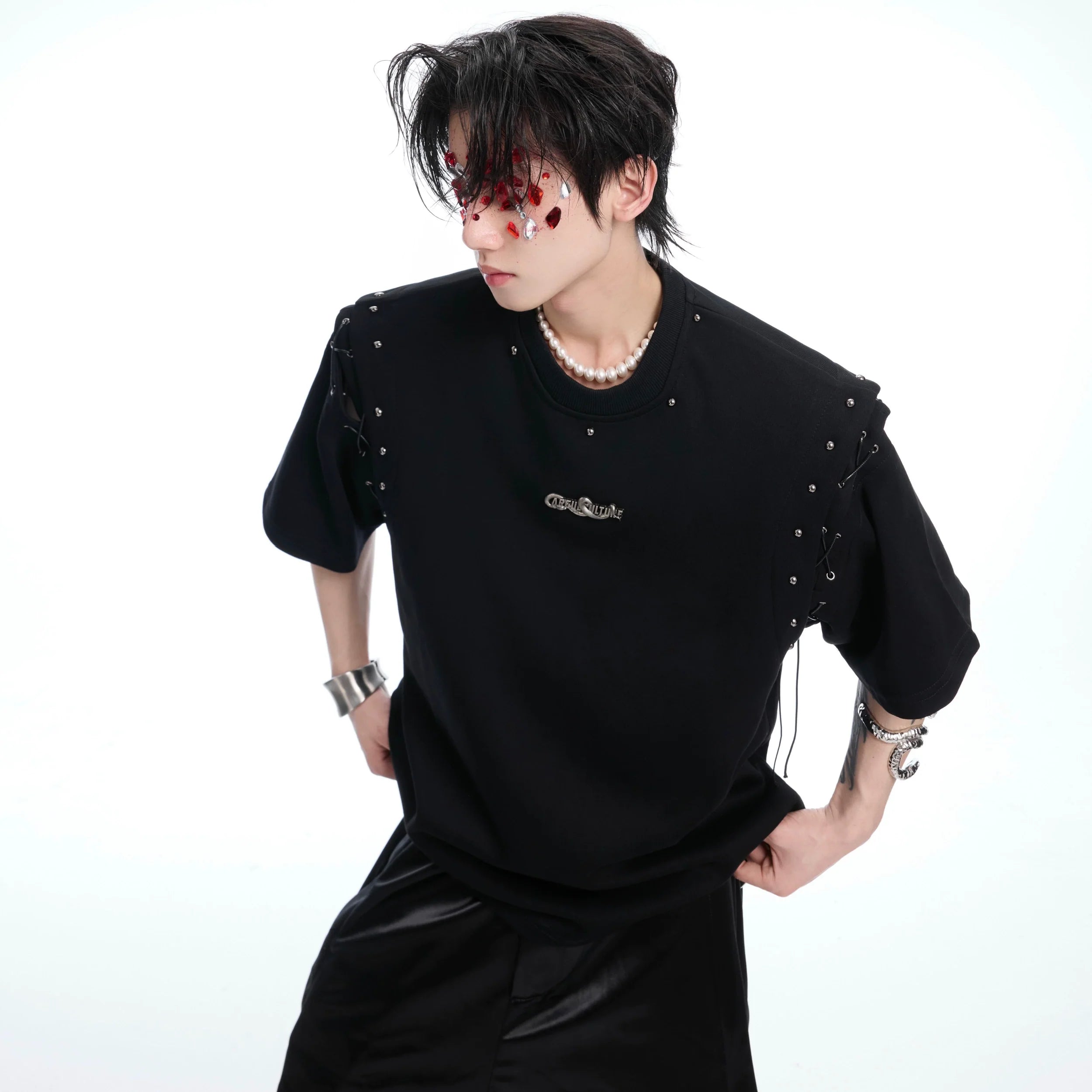 Deconstructed short-sleeve crop tee with edgy snake wrap metal details and lace-up front design