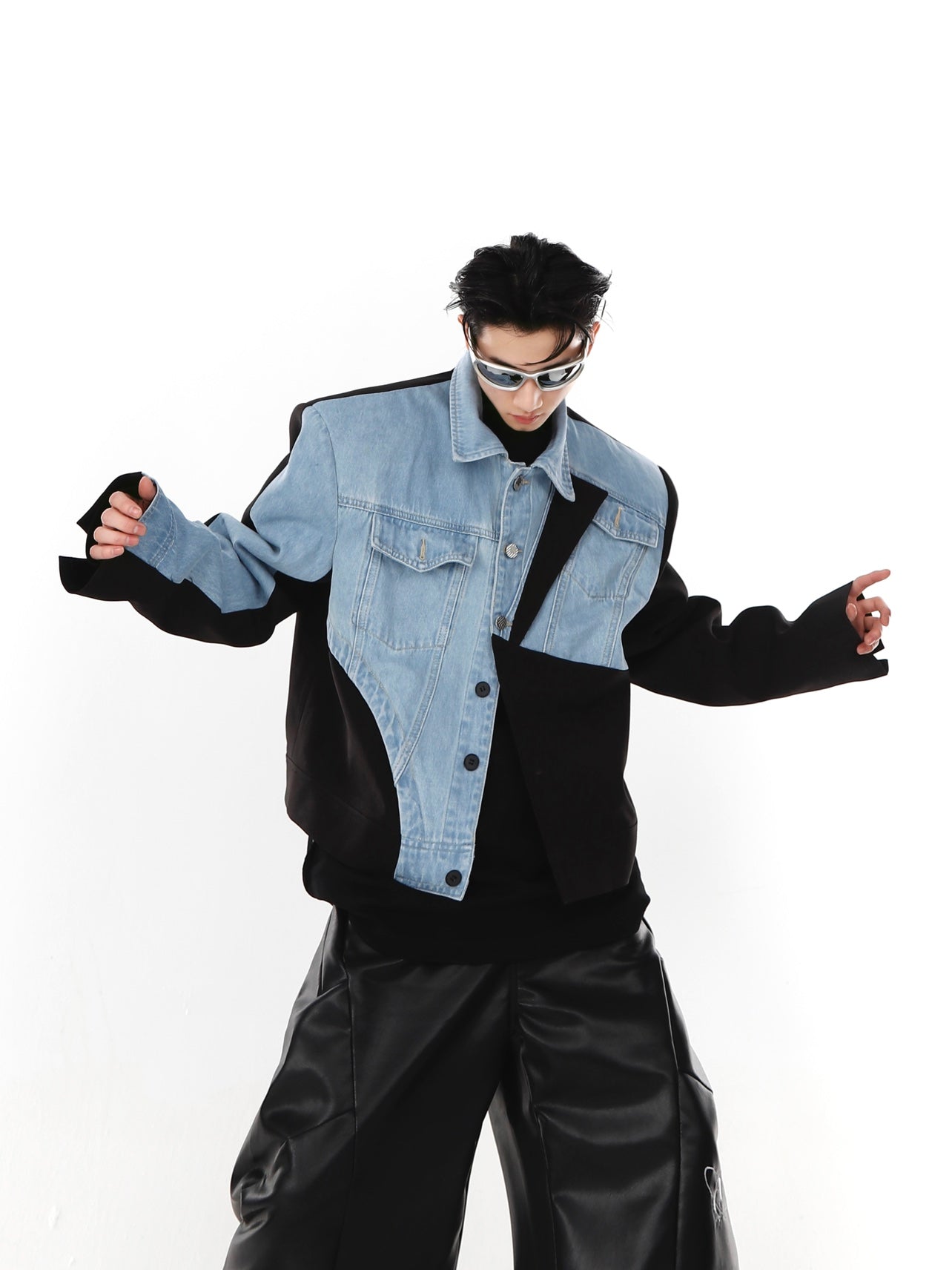 Deconstructed denim-blazer hybrid jacket for men with avant-garde asymmetric design and shoulder pads
