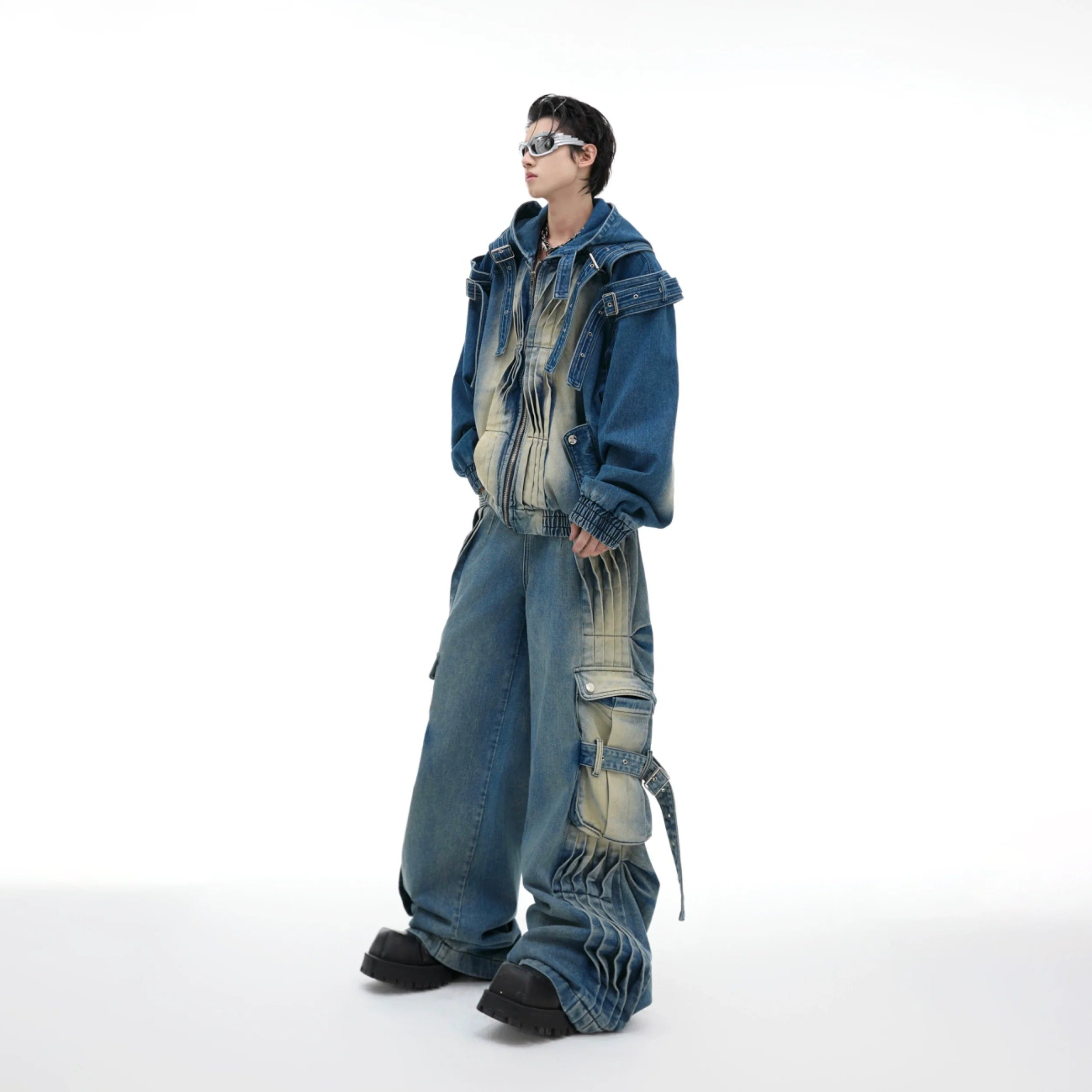 Front view of distressed denim jacket with oversized pockets, showing raw edges and loose fit streetwear style