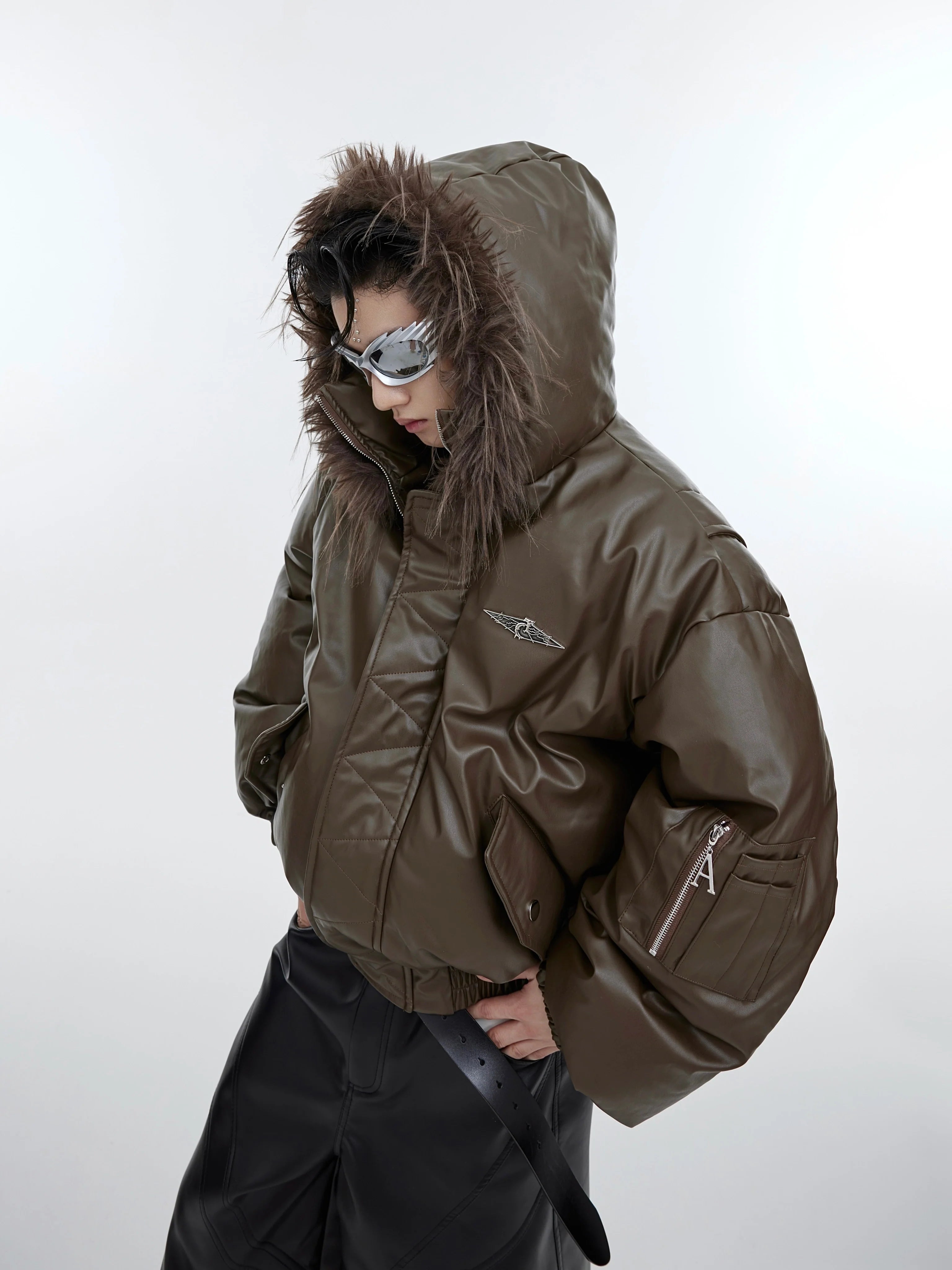 Front view of deconstructed fur-collar puffer jacket showcasing plush textures and hooded streetwear design