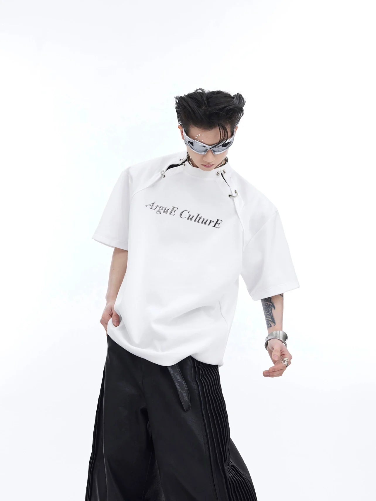 Front view of deconstructed graphic tee with avant-garde cutout design and bold color blocking for streetwear fashion