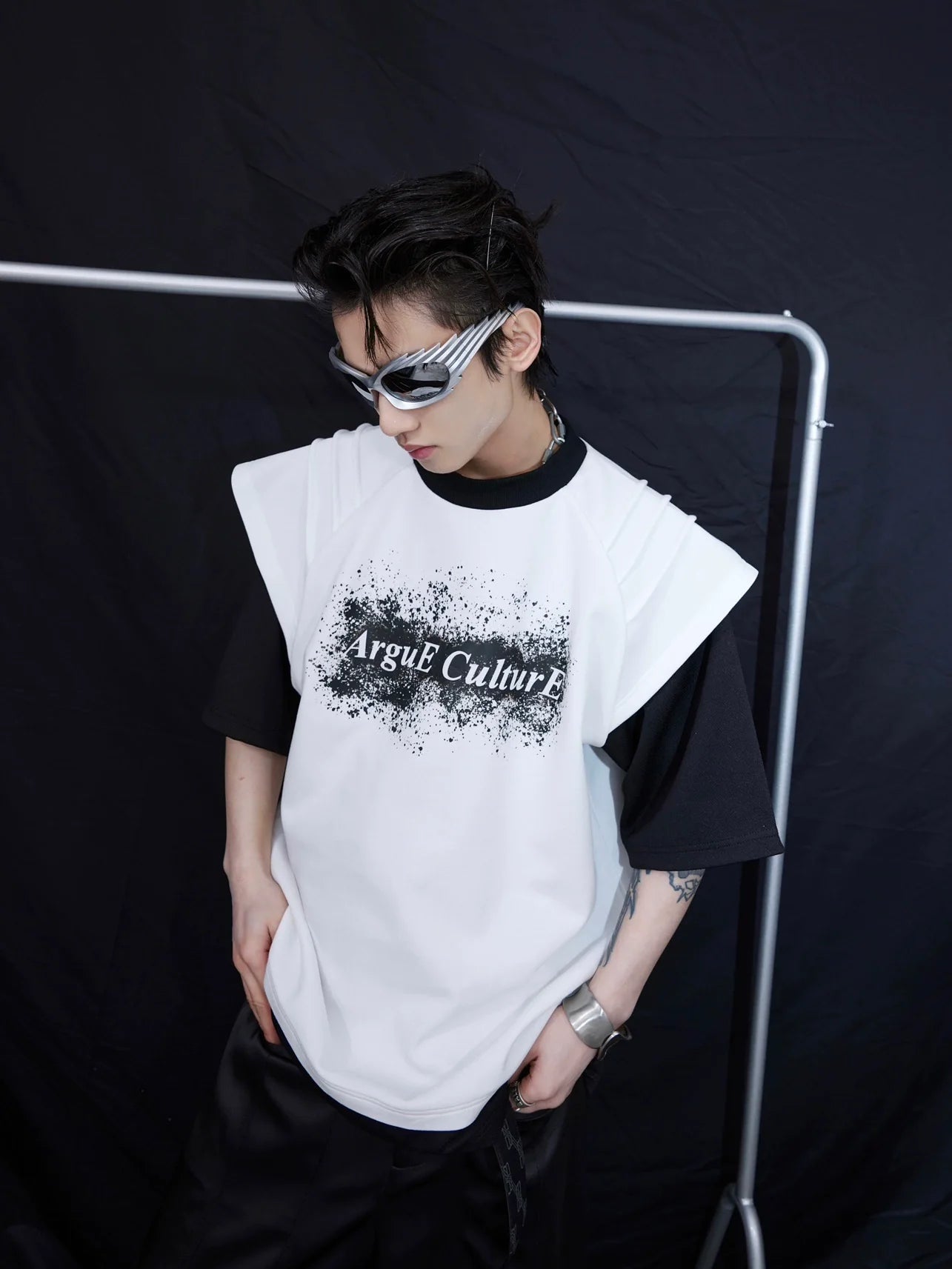Deconstructed graphic tee with distressed ink print, showcasing oversized streetwear style and urban edge design