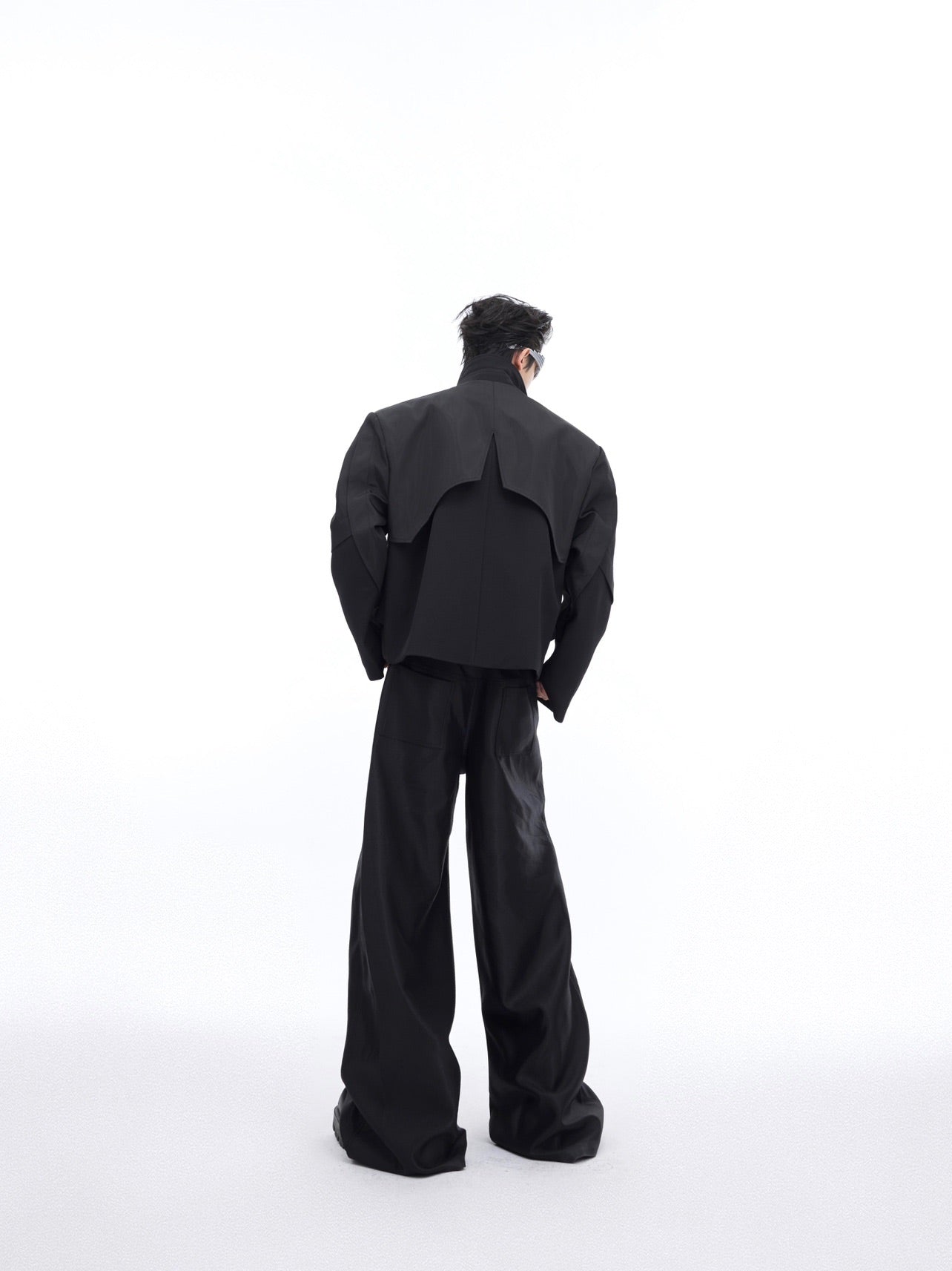 Close-up of premium dual-material construction on this deconstructed spliced jacket with liquid-effect fabric