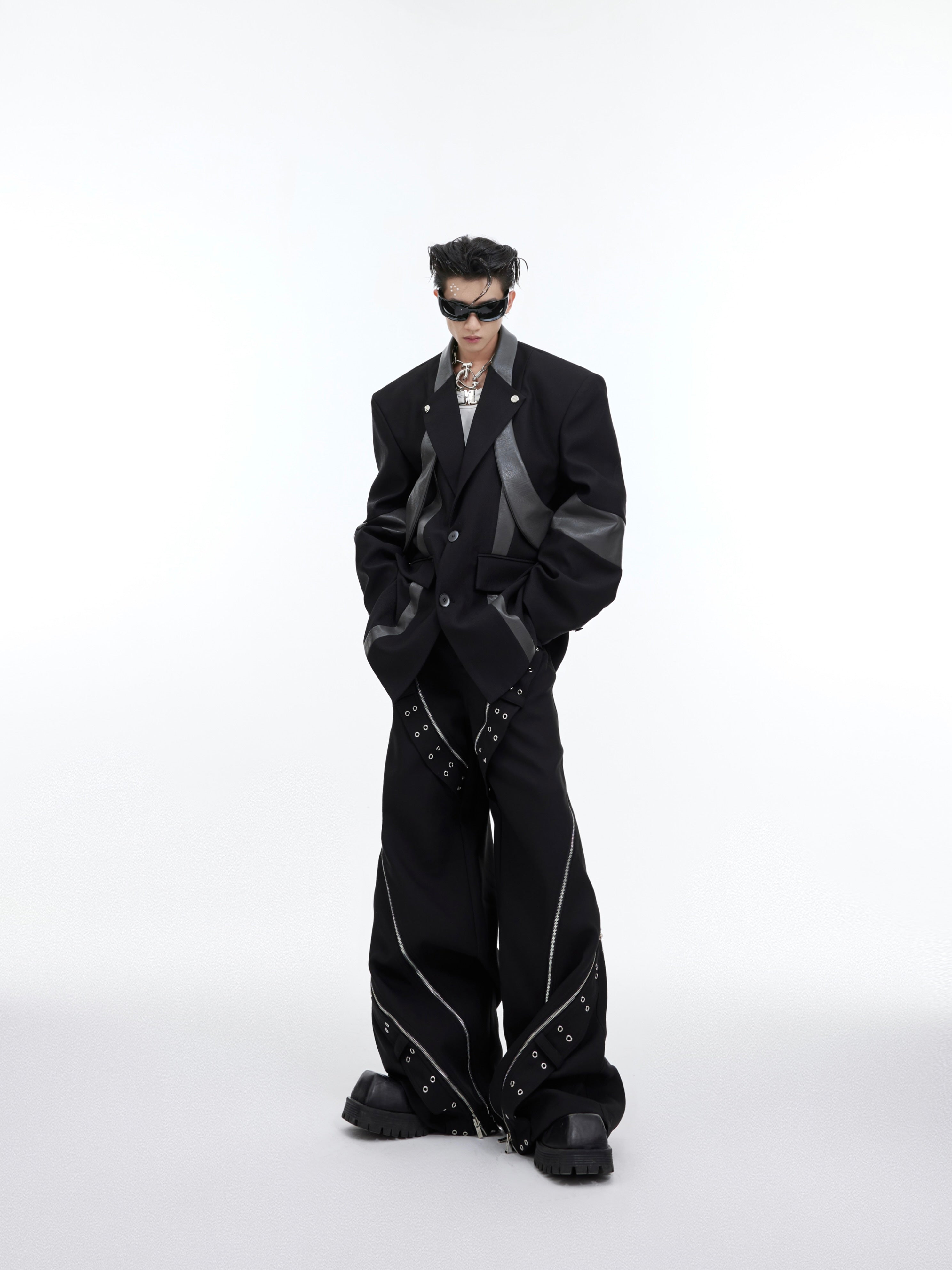 Close-up of statement shoulder pad design on fashion-forward deconstructed blazer