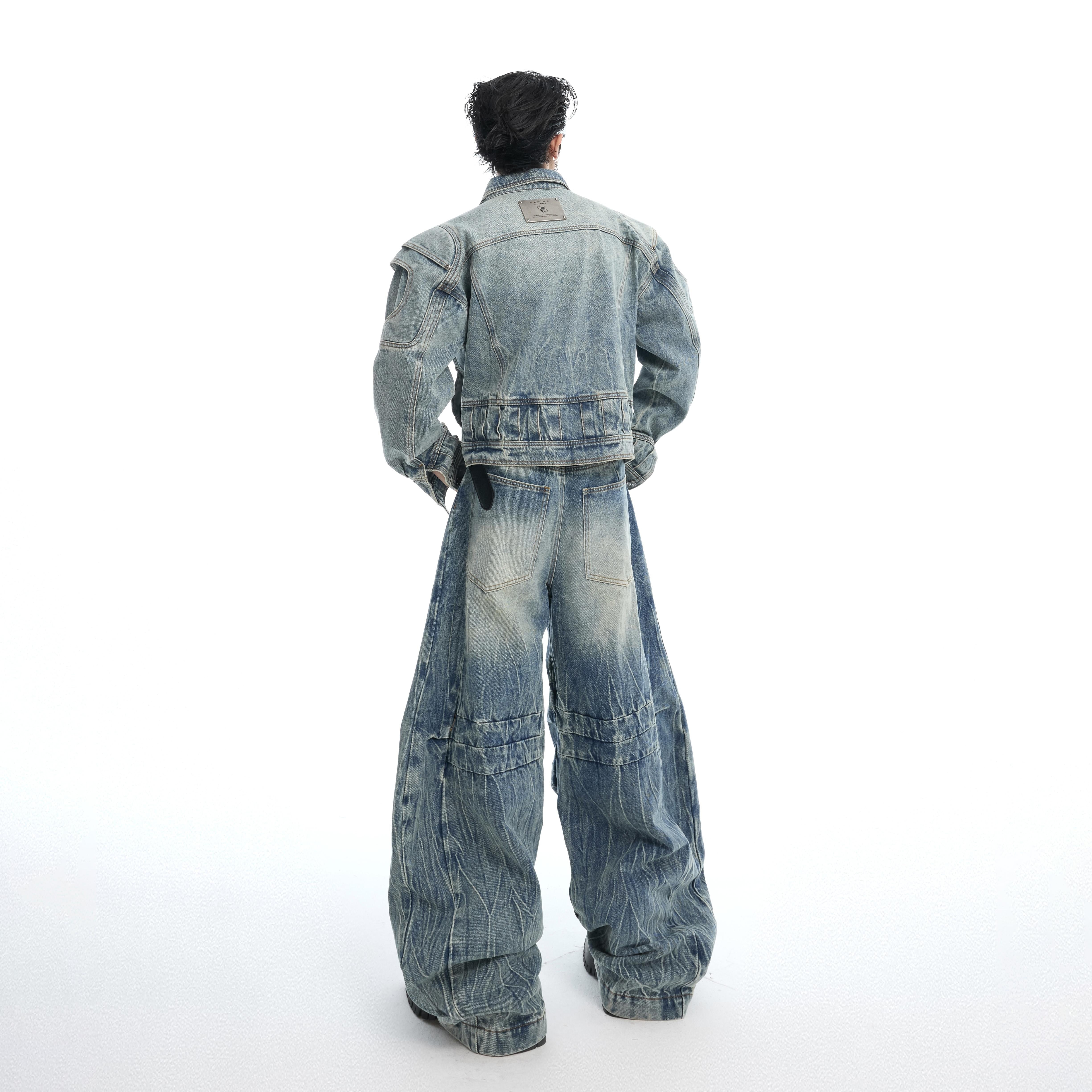 Detailed view of deconstructed baggy jeans showing raw edges, frayed hems and rugged streetwear aesthetic