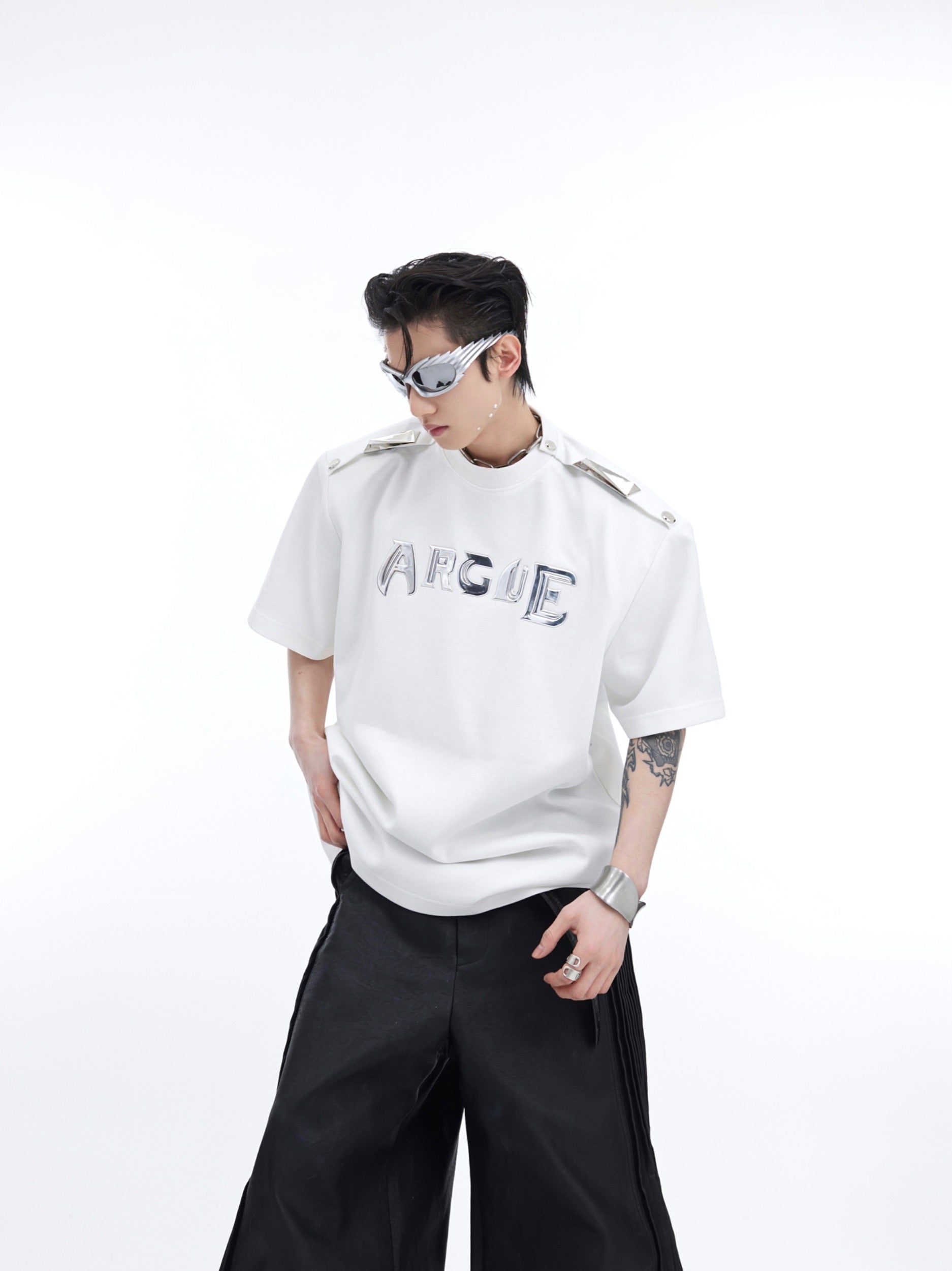 Oversized off-shoulder graphic tee with unique deconstructed metal buttons and color-block design for streetwear fashion
