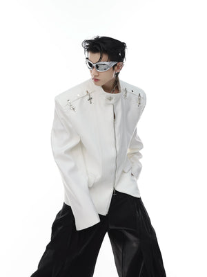 Front view of deconstructed blazer with metal clasp closure and high neck, featuring structured shoulder pads for edgy silhouette