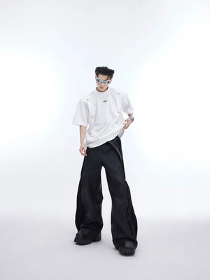Deconstructed streetwear tee with asymmetric round-hole cutouts and metal detailing, oversized drop-shoulder design