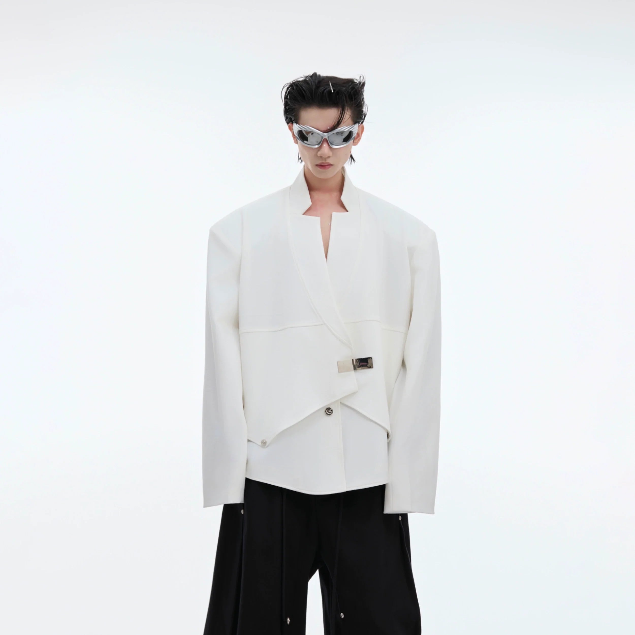 Front view of deconstructed metallic-button blazer with glitter detailing and oversized fit for streetwear style
