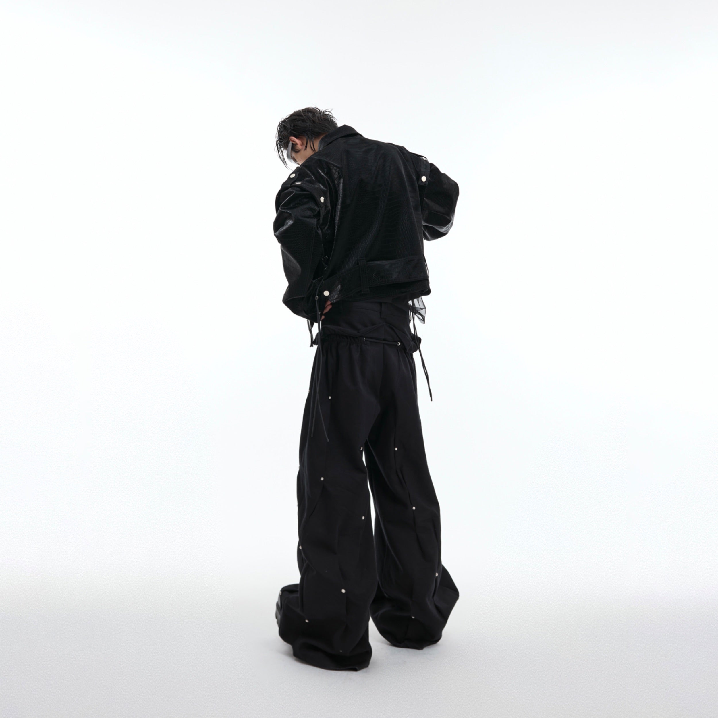 Detailed shot of the innovative deconstructed military collar on this high-fashion leather jacket