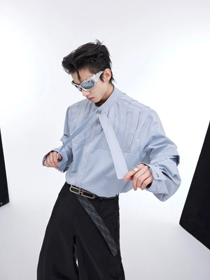 Deconstructed pleated oversized shirt in streetwear style with unique patchwork detailing and long sleeves