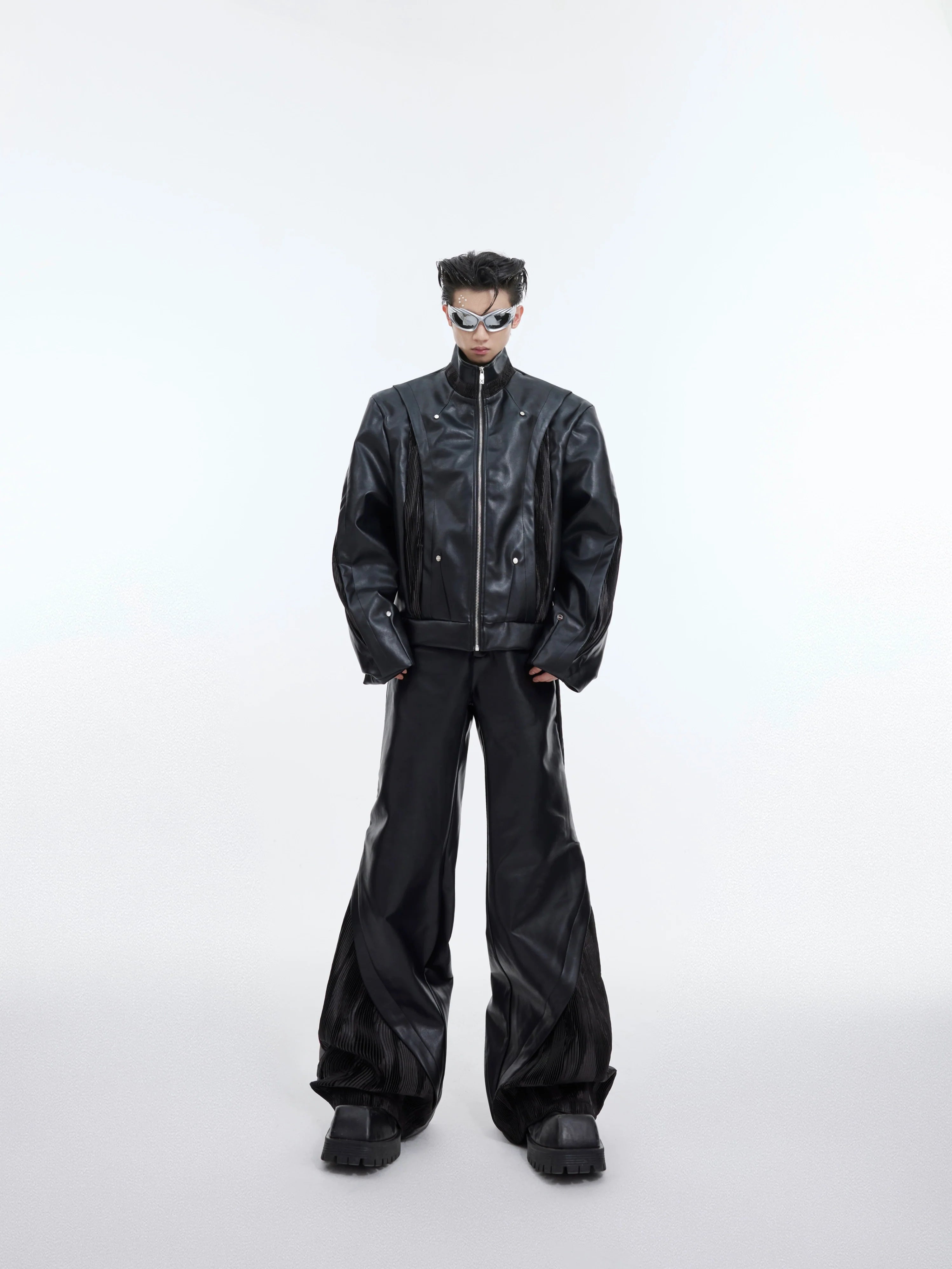 Deconstructed PU leather biker jacket with asymmetrical draping and metal accents for urban streetwear style