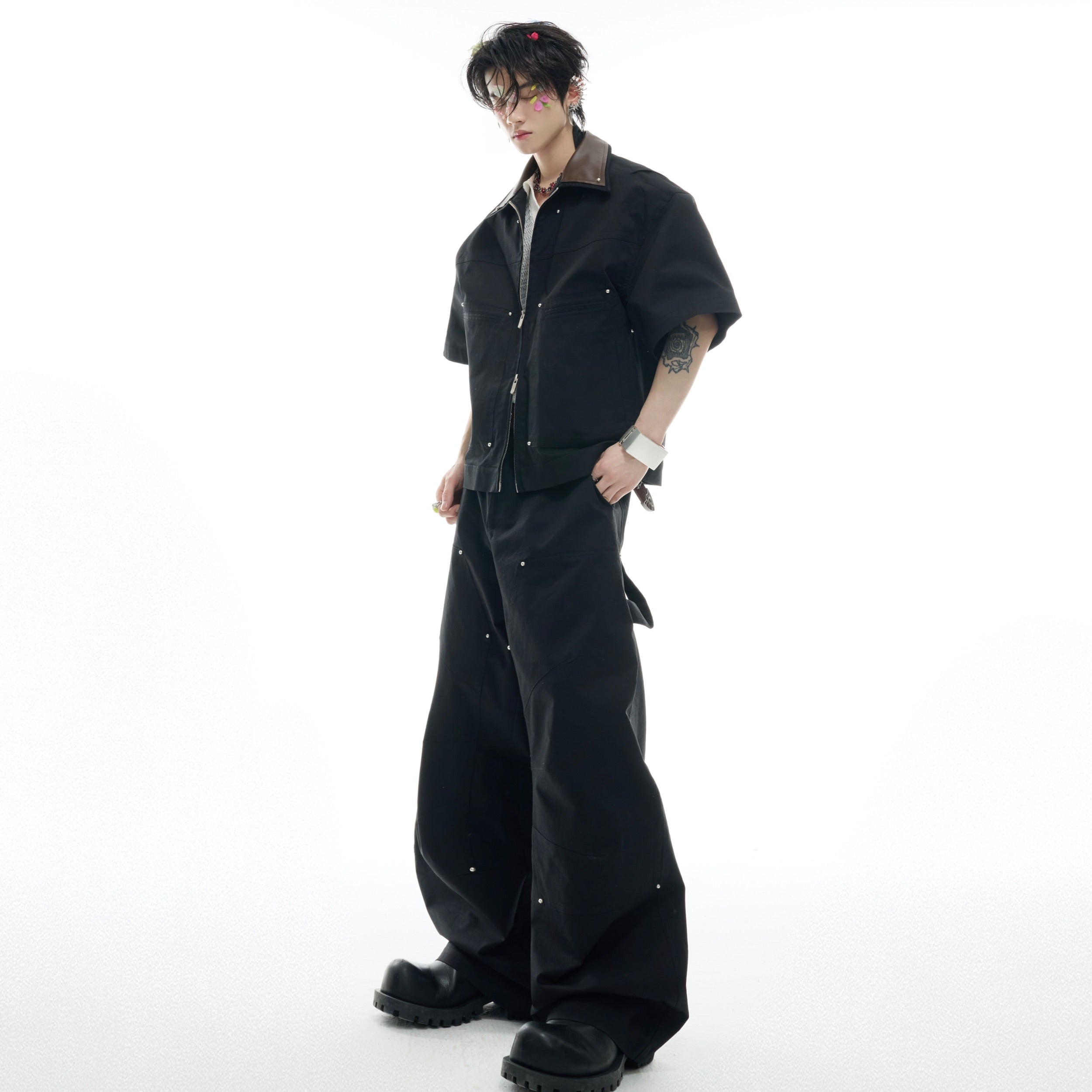 Deconstructed PU leather sleeve tee paired with studded cargo pants set, featuring asymmetric streetwear design