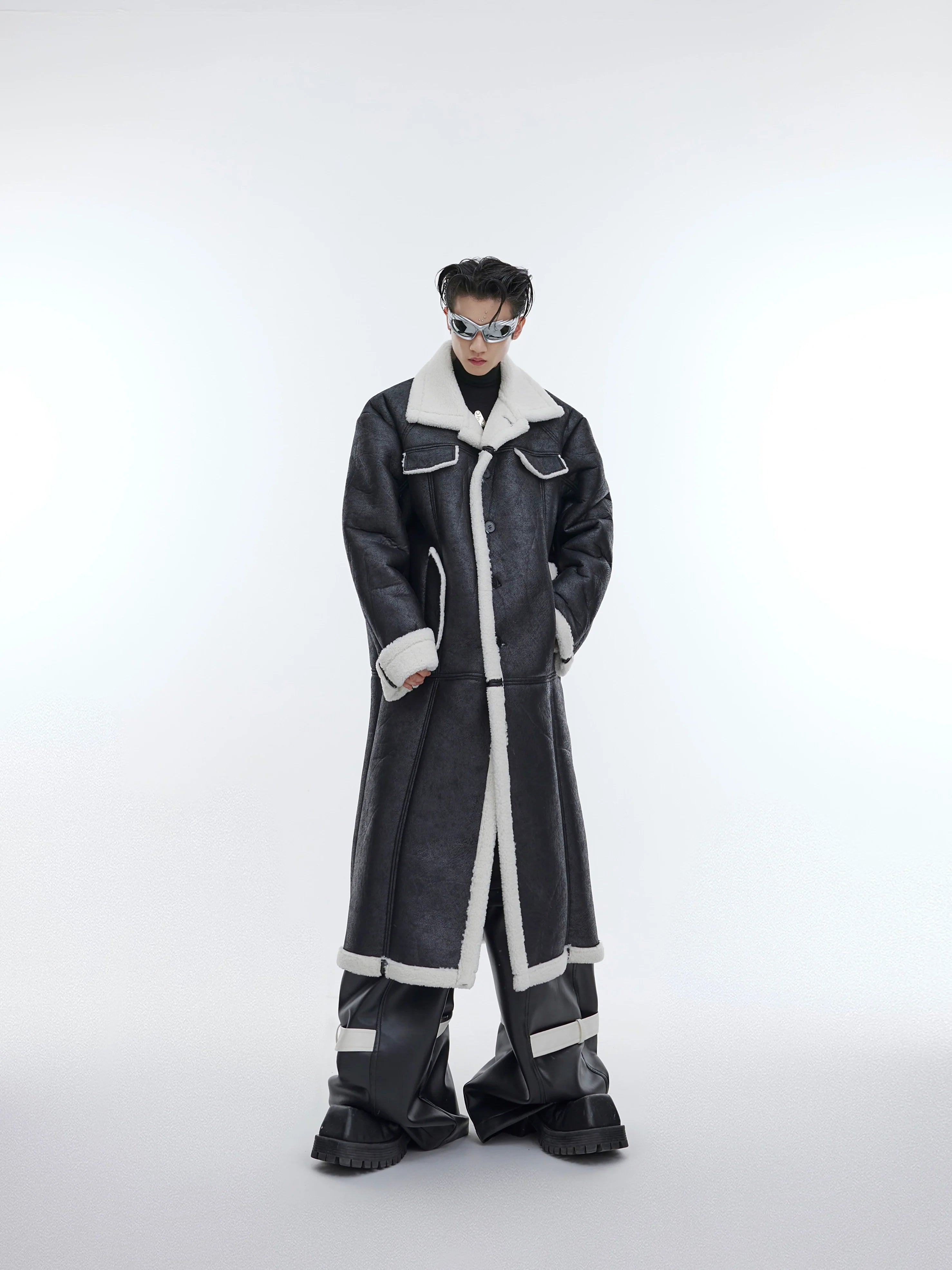Deconstructed shearling long coat with unique patchwork detailing, showcasing avant-garde streetwear fashion