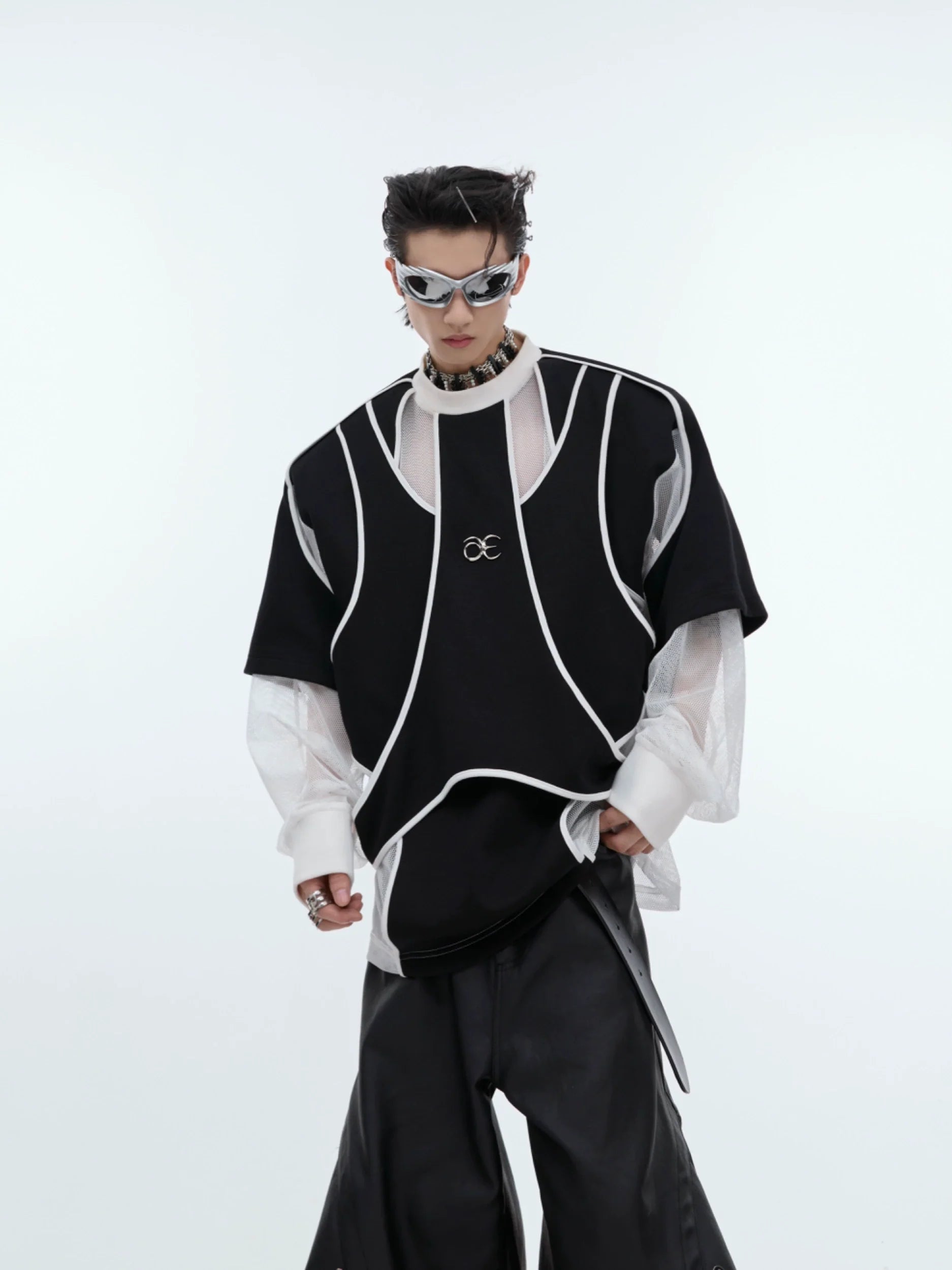 Deconstructed split hoodie with heavyweight metal trim detail, showcasing the drop shoulder design and urban streetwear aesthetic
