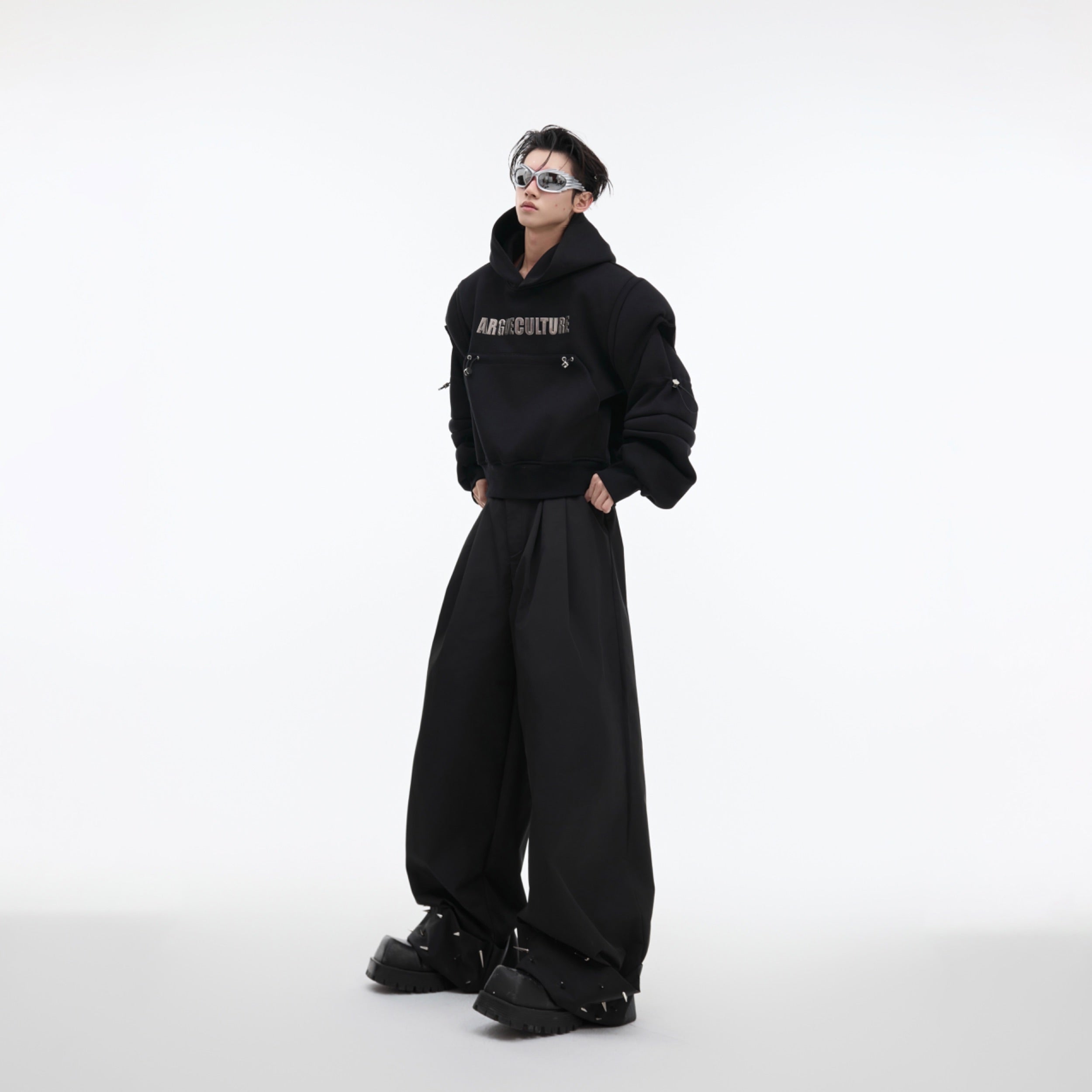 Side angle of the cropped oversized sweatshirt highlighting its distinctive deconstructed design elements