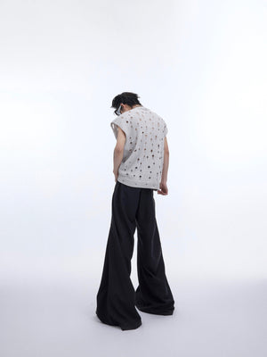 Layering detail of the distressed metallic tank top with sheer cape for edgy streetwear looks