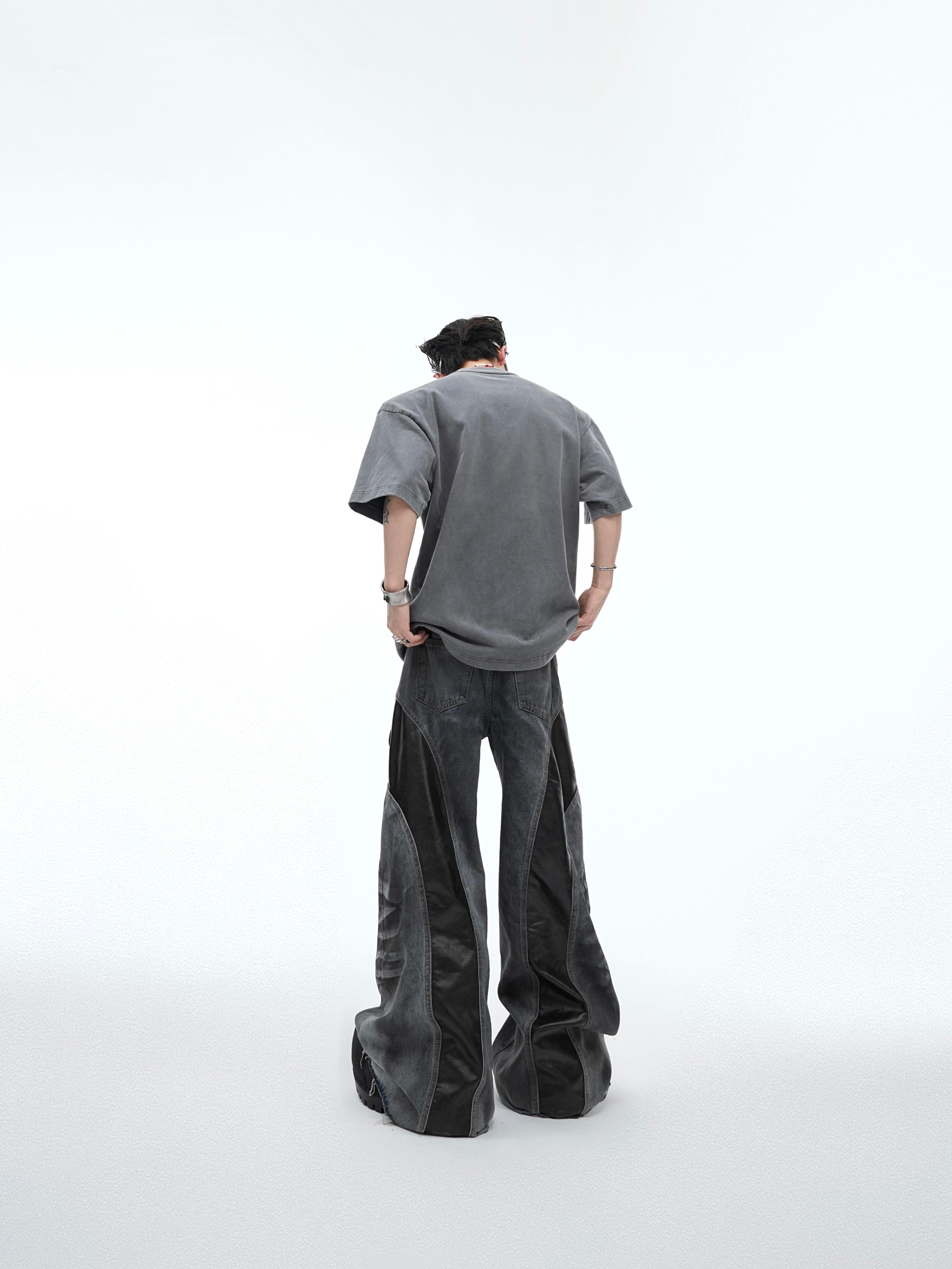 Back view of deconstructed streetwear t-shirt featuring unique glitter print and vintage wash effect