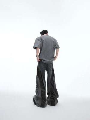 Back view of deconstructed streetwear t-shirt featuring unique glitter print and vintage wash effect