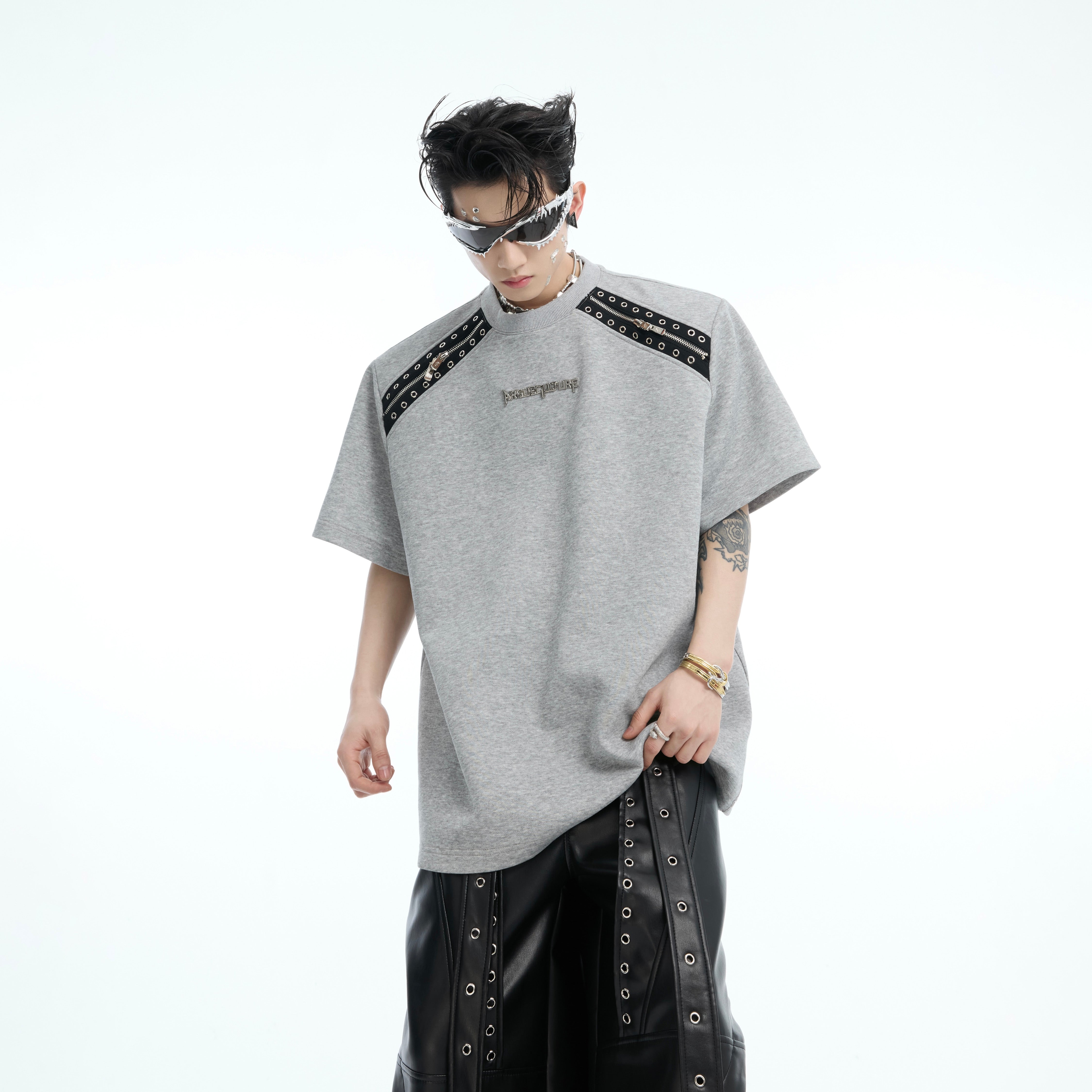 Back view of the fashion-forward color-block tee showing the deconstructed design elements and brand tag