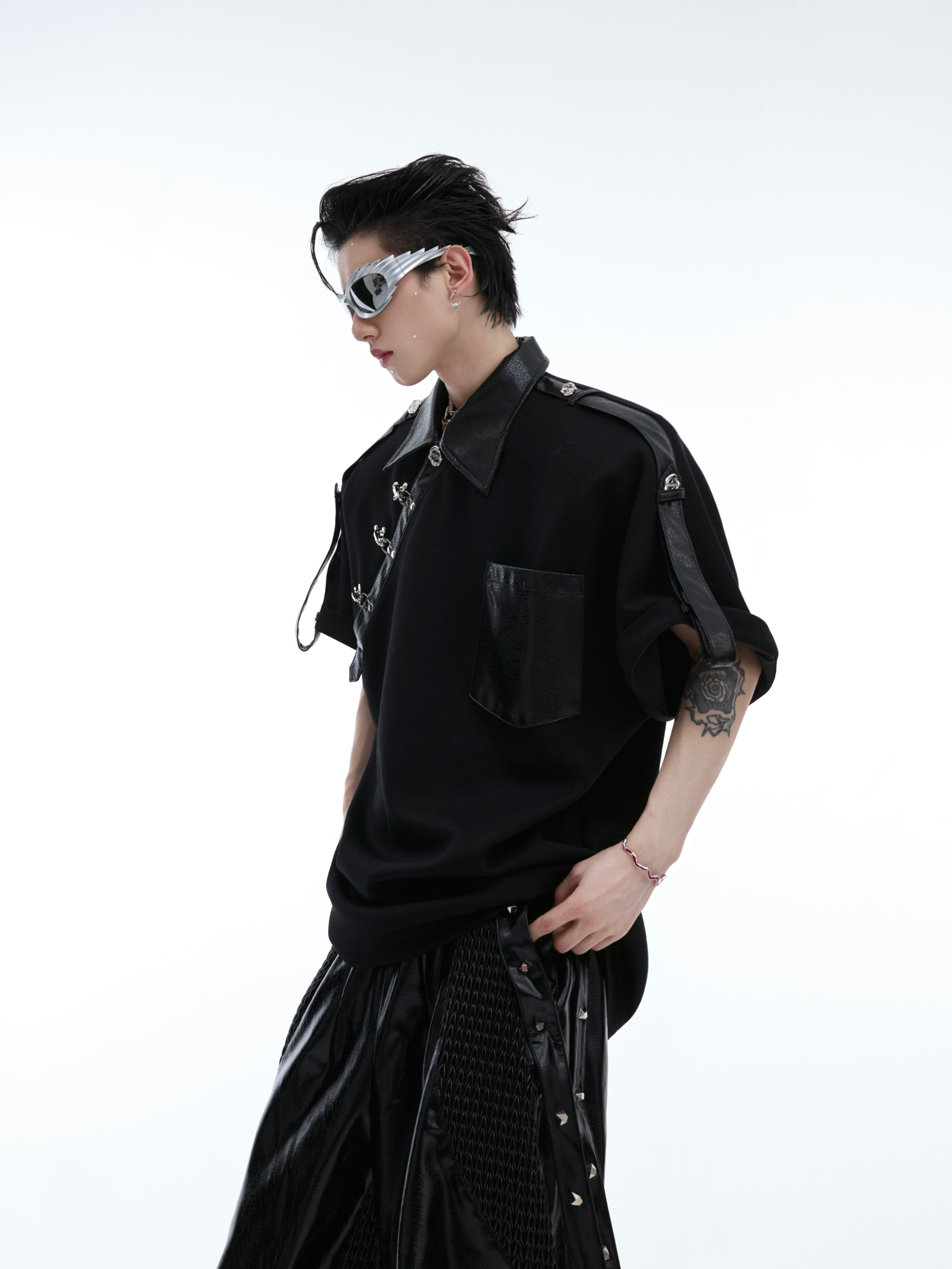 Back view of fashion-forward polo tee featuring structural metal accents and new Chinese design elements