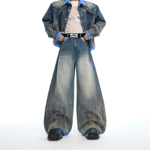 Back view showing the artisan patchwork design and faux two-piece construction of the denim jacket