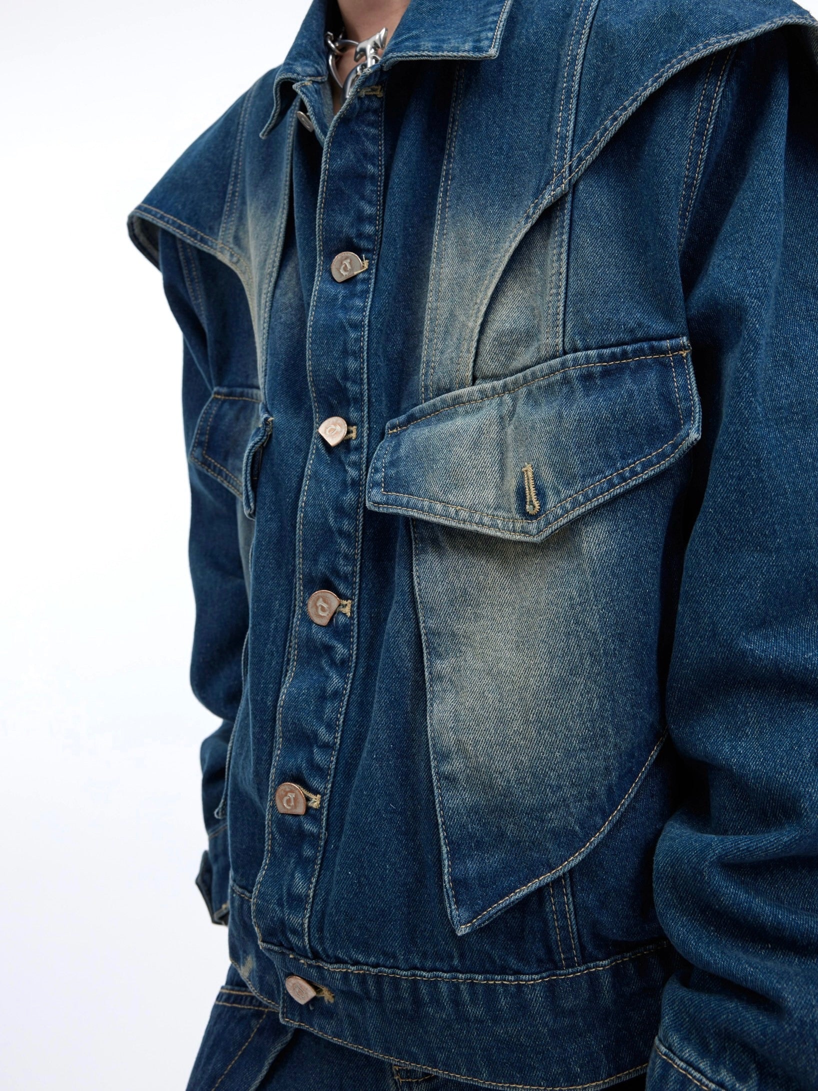Full front view of model wearing deconstructed denim set showing cropped jacket and wide pants