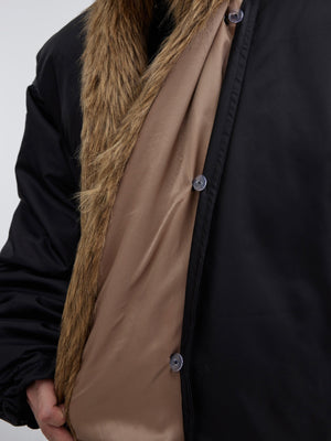 Close-up of premium detachable plush collar on winter puffer coat for versatile styling