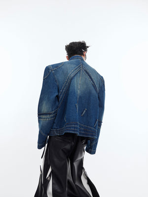 Side angle showing the irregular distressing and reconstructed seams on this artistic men's denim coat