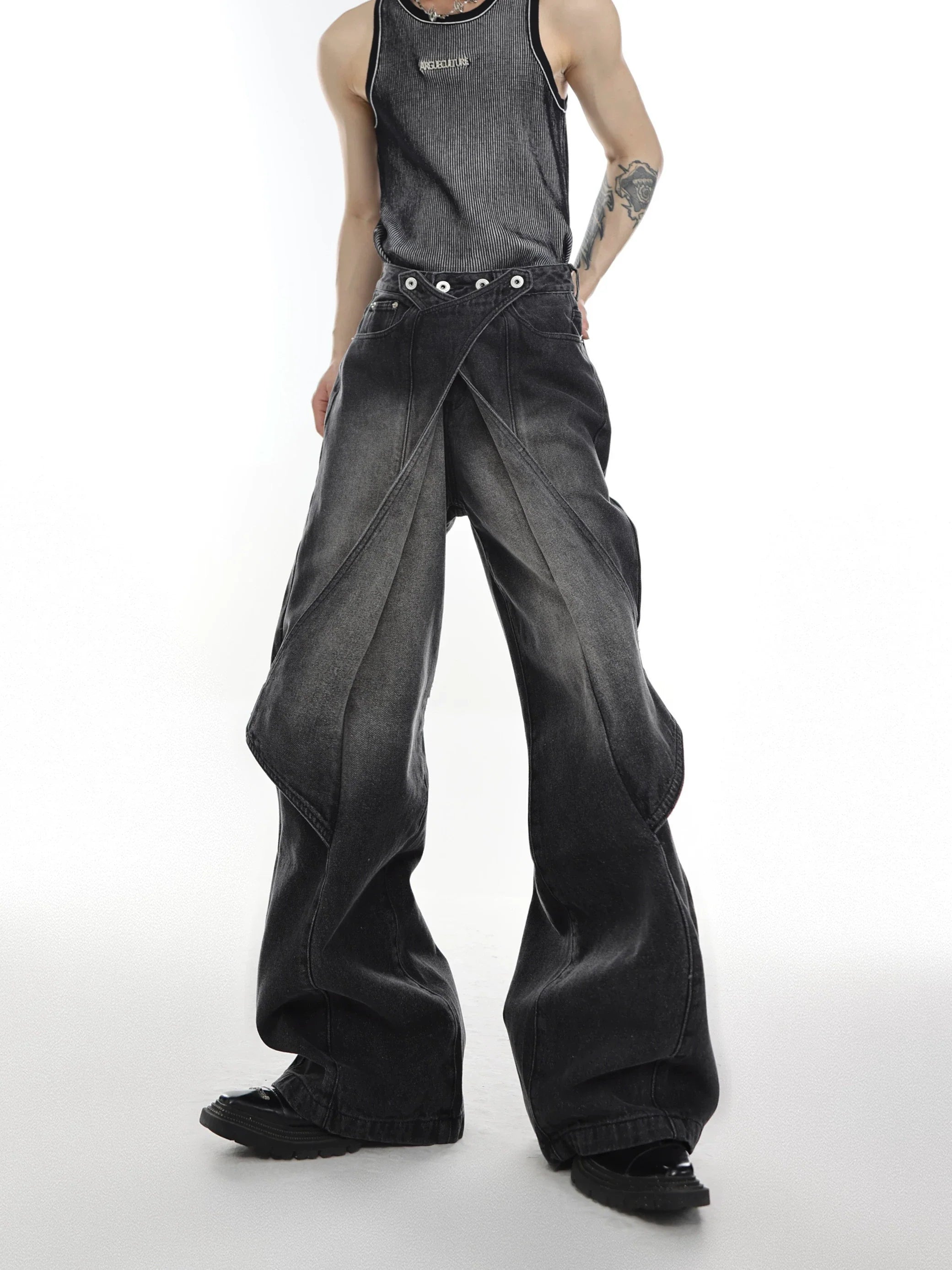Distressed deconstructed flare jeans with unique double waistband design, raw hem detailing and wide leg silhouette