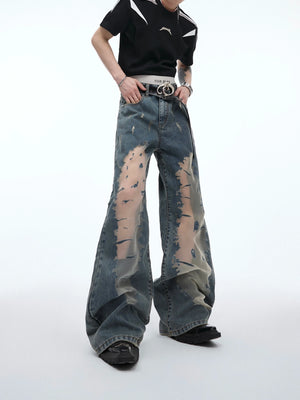 Front view of vintage distressed hollow-out flared jeans showcasing unique deconstructed streetwear design with washed denim texture