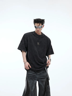 Distressed oversized vintage t-shirt featuring edgy metal stud detailing on premium cotton fabric, perfect for streetwear looks