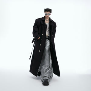 Back view of the double-breasted trench coat highlighting its deconstructed design and sophisticated silhouette