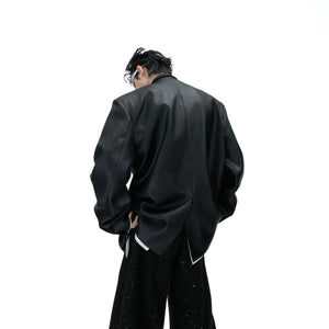 Back view showing the tailored structure and waxed finish of this pearl-embellished streetwear blazer