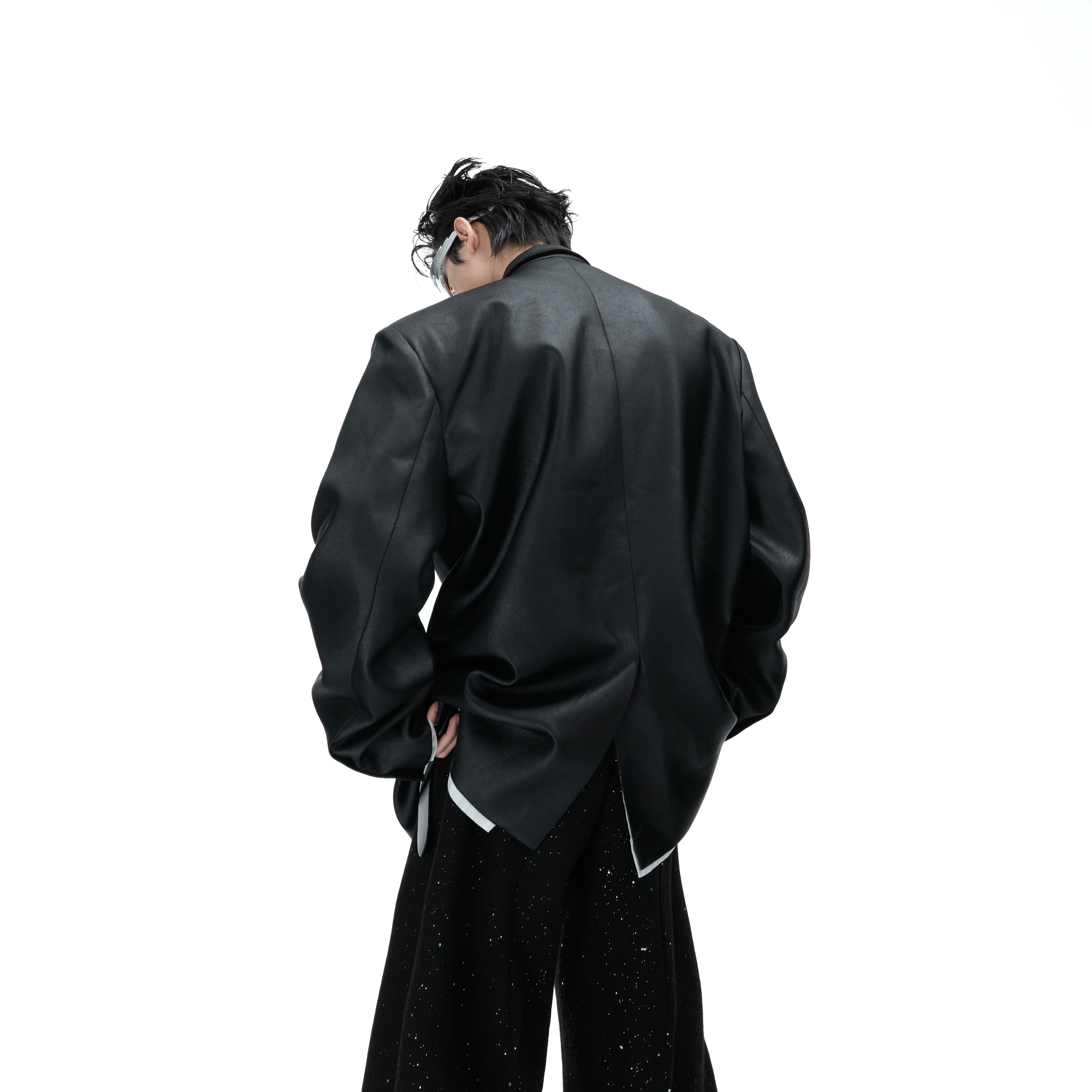 Back view showing the tailored structure and waxed finish of this pearl-embellished streetwear blazer