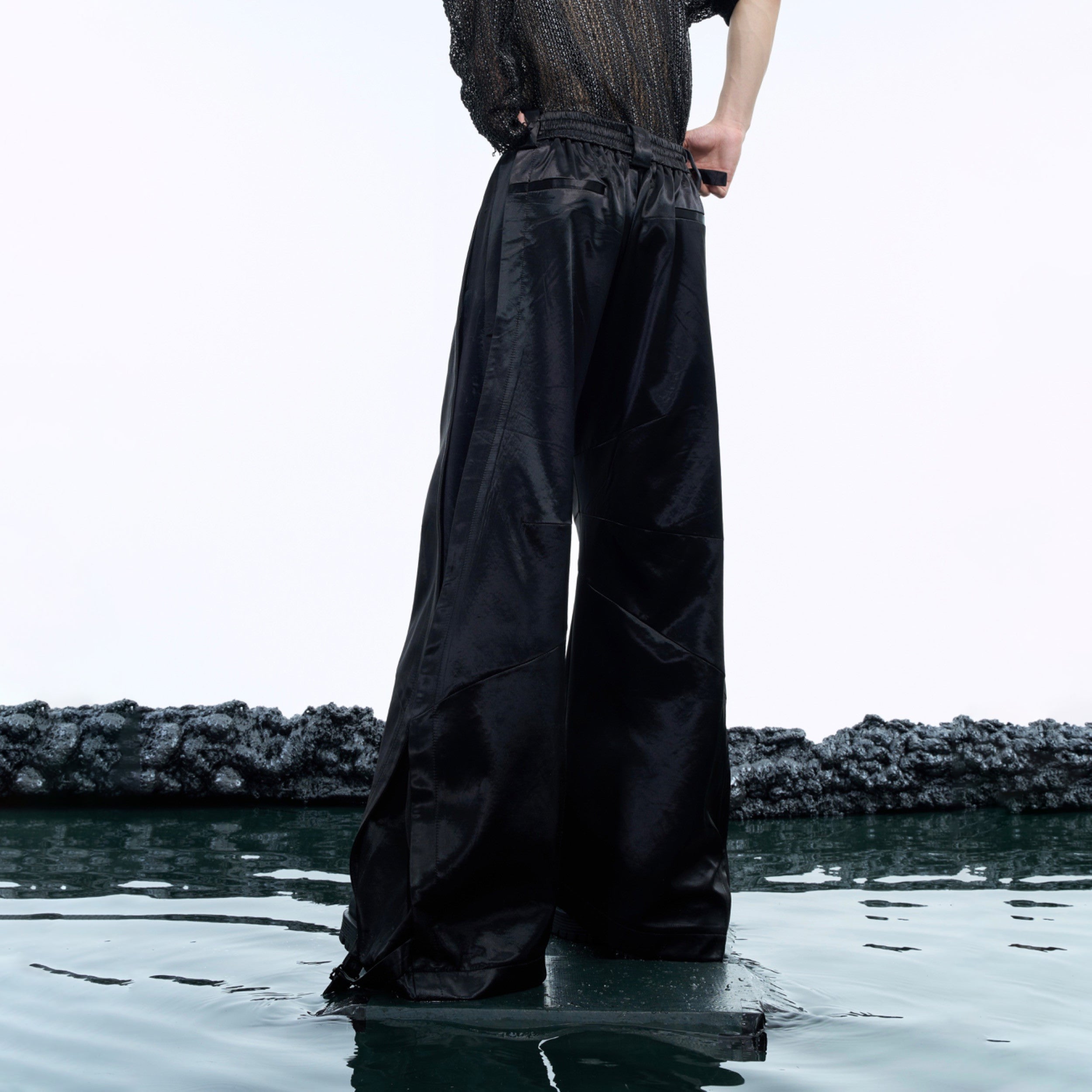 Close-up of premium soft-touch fabric on wide-leg drop-crotch trousers with excellent breathability