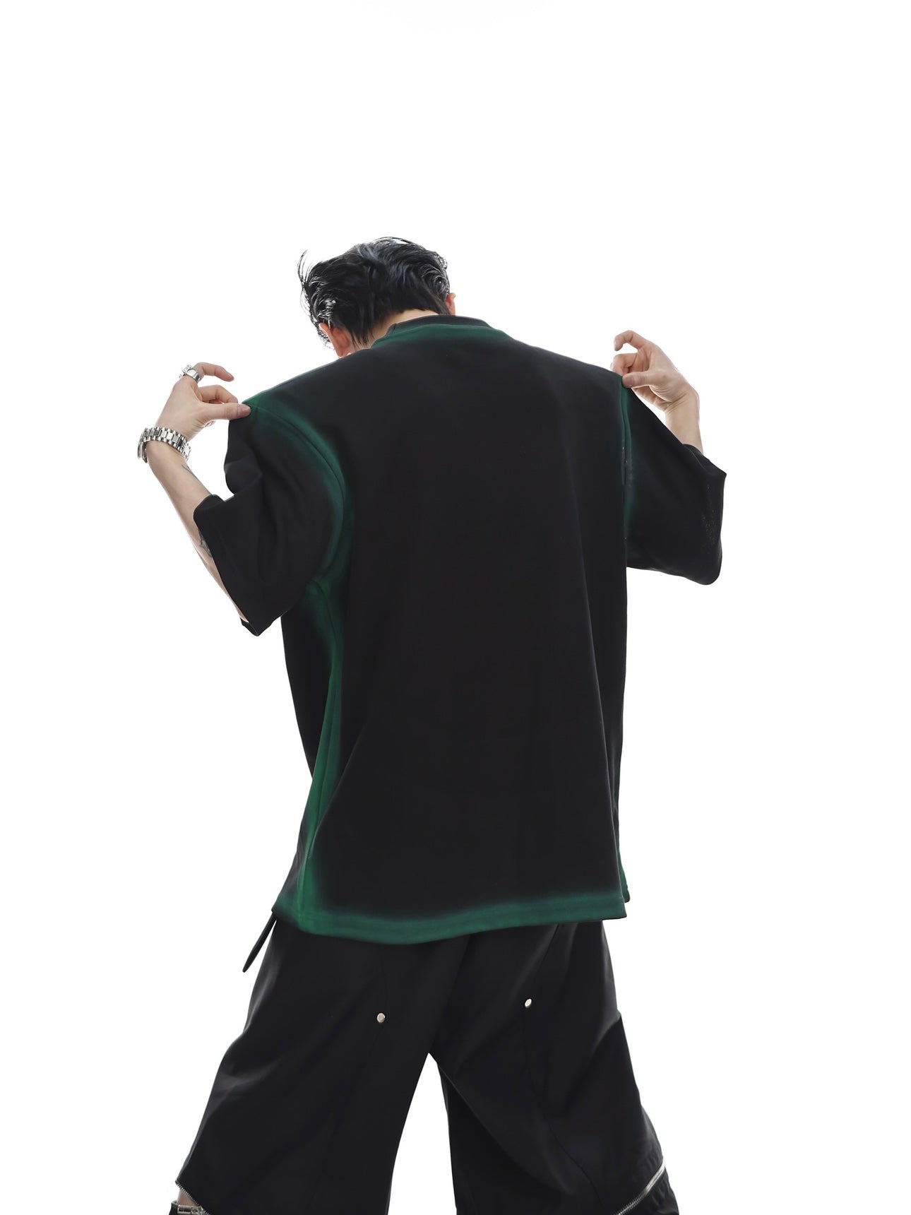 Side angle view showing drop-shoulder design of graffiti graphic t-shirt with metallic gradient print