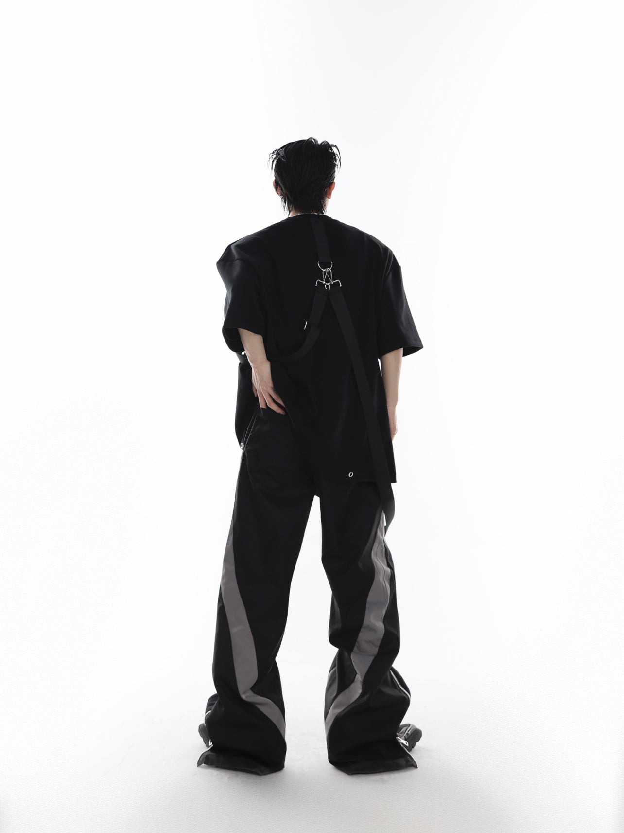 Side angle showing the controversial loose-leaf front detail and avant-garde streetwear design