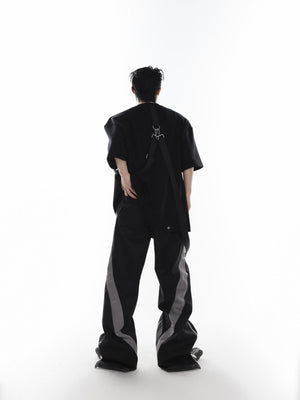 Side angle showing the controversial loose-leaf front detail and avant-garde streetwear design