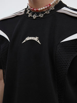Fashion-forward streetwear top with accentuated silhouette and modern deconstructed design