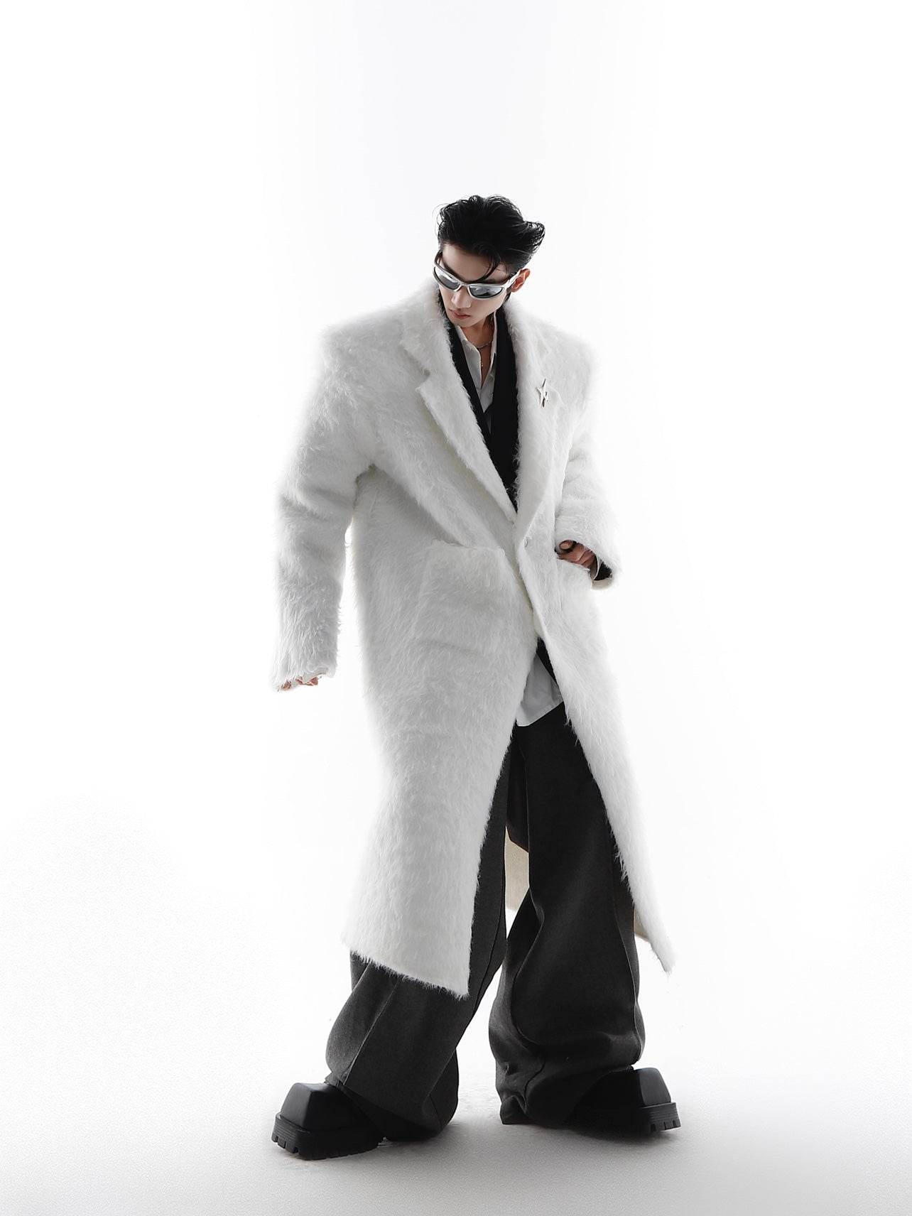 Back view of winter white coat showing belted closure and luxurious faux fur texture