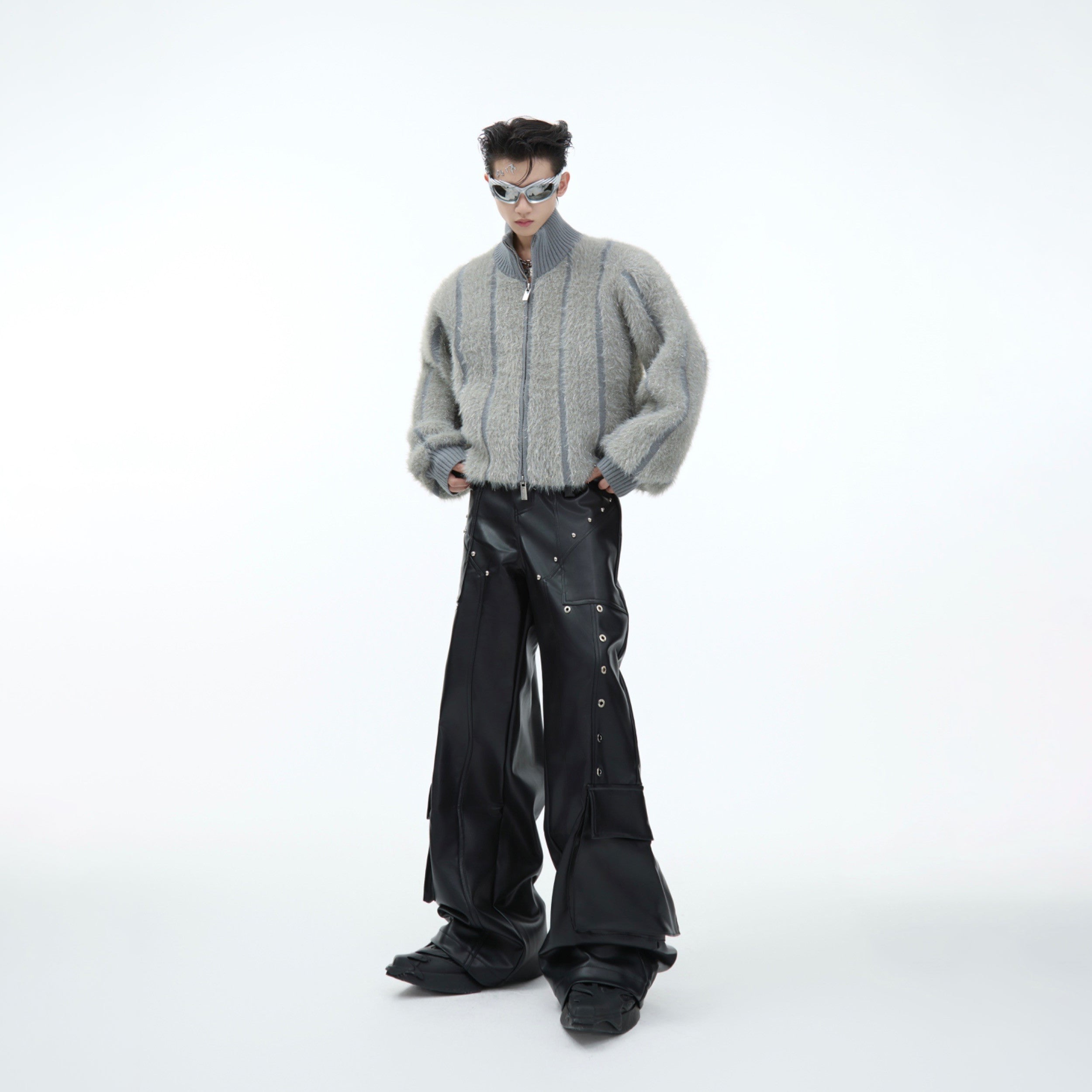 Side angle of luxurious silver knit sweater showing cropped length and fluffy turtleneck