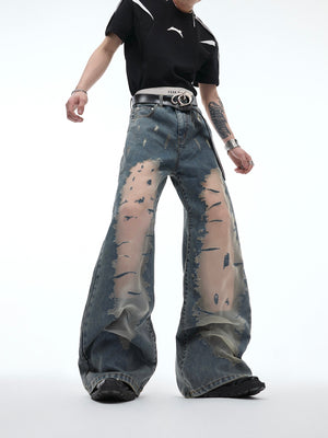 Back view of the distressed flared jeans highlighting the vintage wash and deconstructed hollow-out pattern details