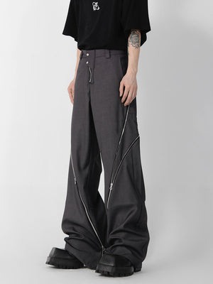 Close-up of distressed straight-leg trousers featuring unique front zipper design and contemporary tailoring