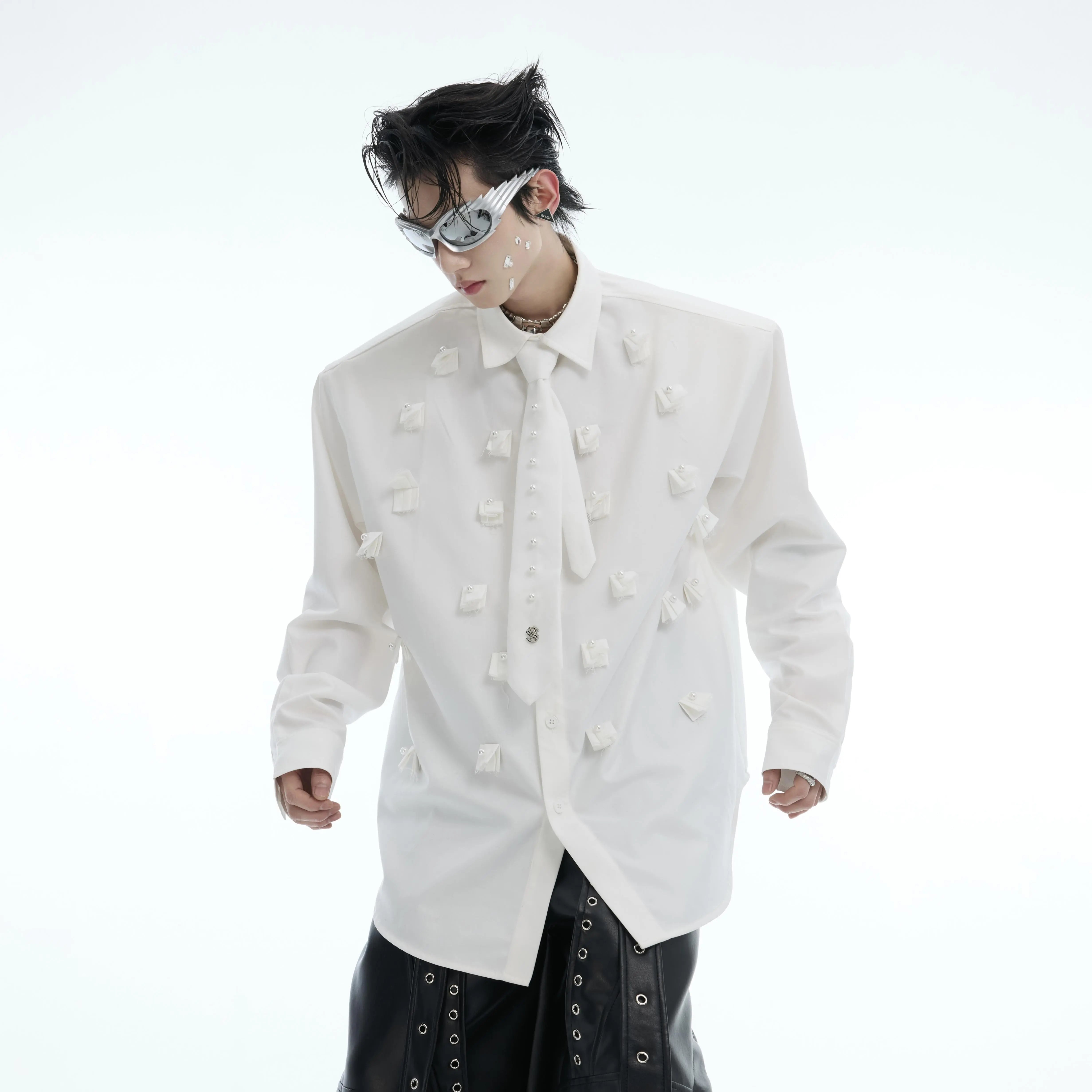 Front view of floral print oversized shirt with elegant pearl-trimmed detailing and detachable tie