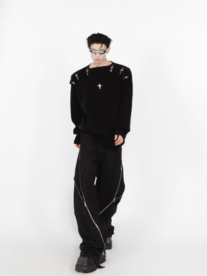Closeup of industrial metal hardware on trendy hollow-knit cotton sweater