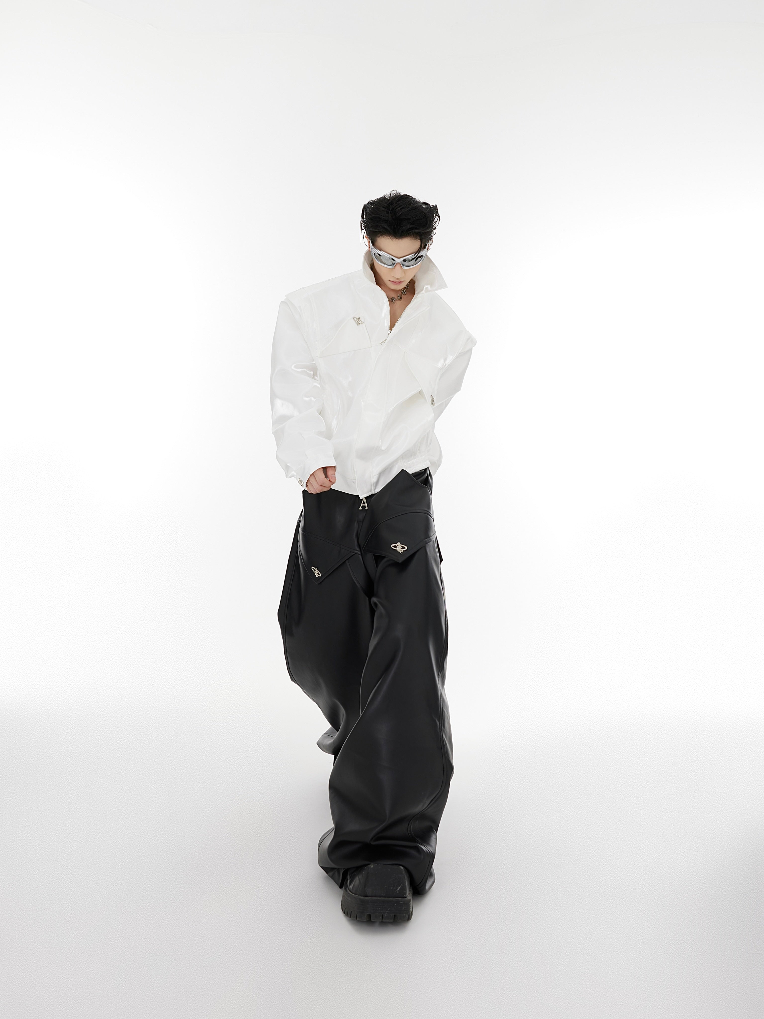Avant-garde leather jacket showcasing bold geometric details and an innovative liquid shoulder construction